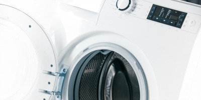 Washing Machine Repair Perth. Washing machine with an open door detail on white background